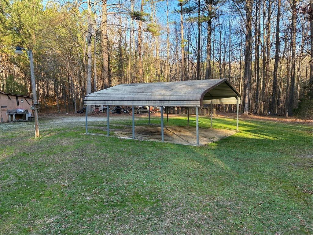 244 Manors Mill Road Dallas, GA 30157 - Photo 27 of 39 a view of a house with a yard