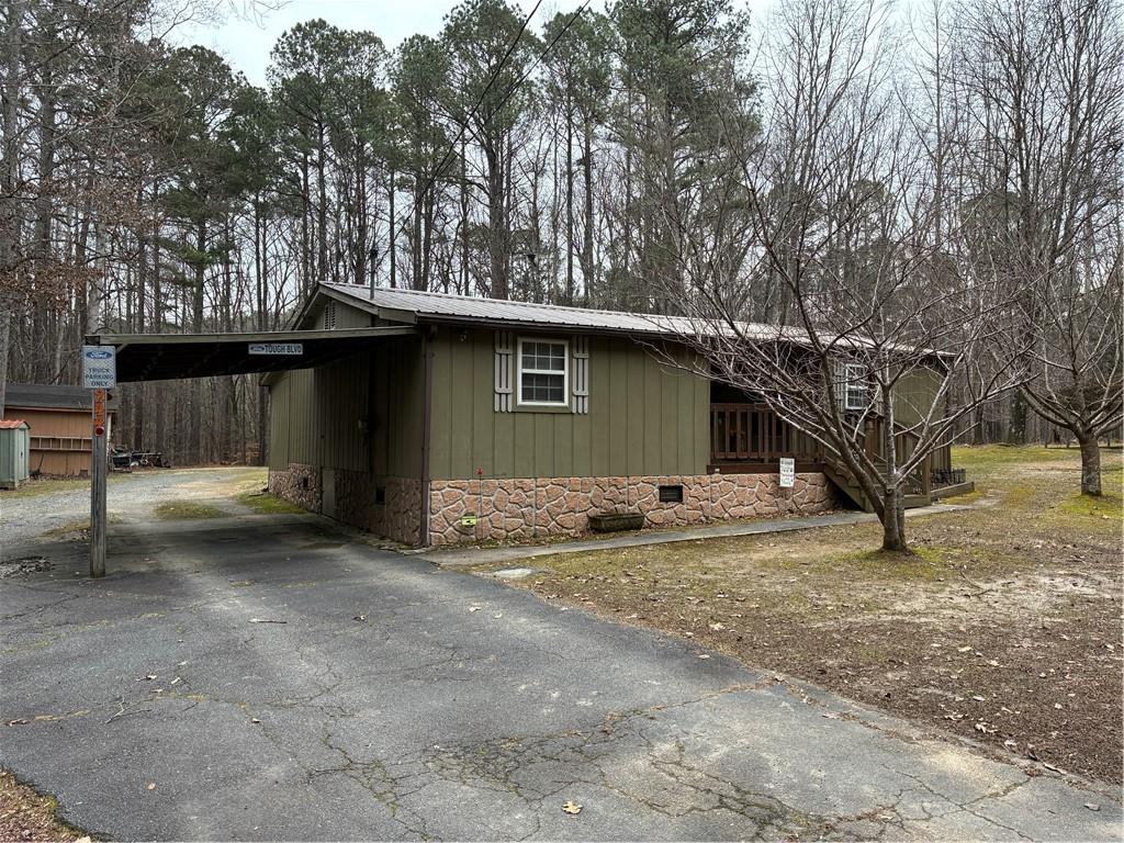244 Manors Mill Road Dallas, GA 30157 - Photo 28 of 39 a view of a house with a tree in a yard