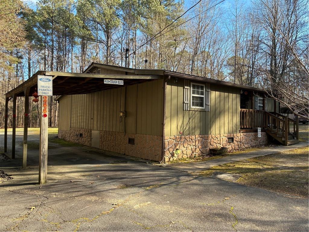 244 Manors Mill Road Dallas, GA 30157 - Photo 29 of 39 a view of a house with a large tree
