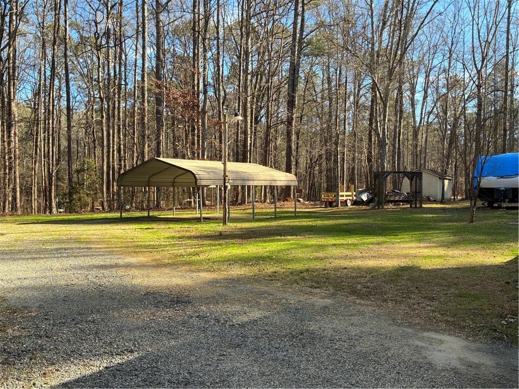 244 Manors Mill Road Dallas, GA 30157 - Photo 30 of 39 a view of a swimming pool with an outdoor space and seating area