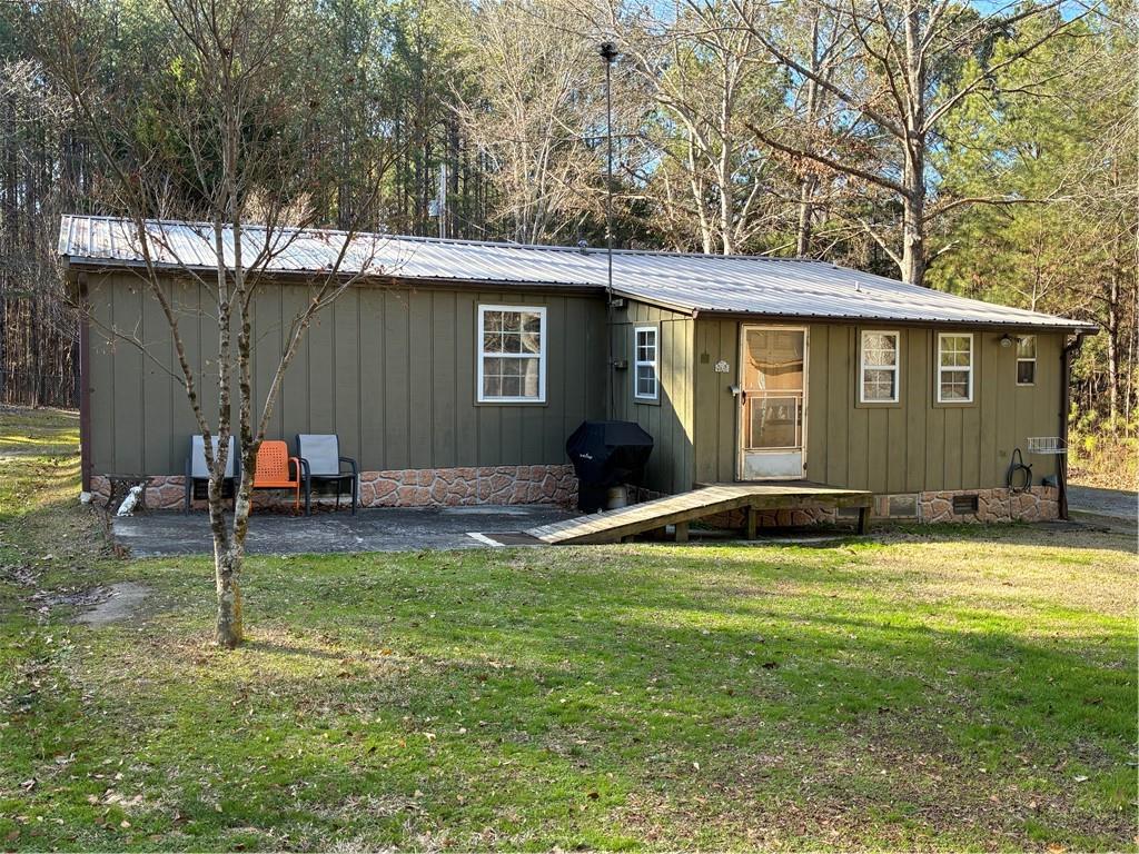 244 Manors Mill Road Dallas, GA 30157 - Photo 31 of 39 a backyard of a house with seating space