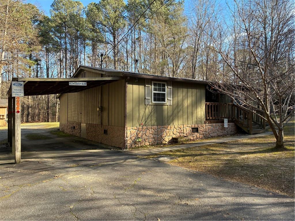 244 Manors Mill Road Dallas, GA 30157 - Photo 36 of 39 a house with trees in the background