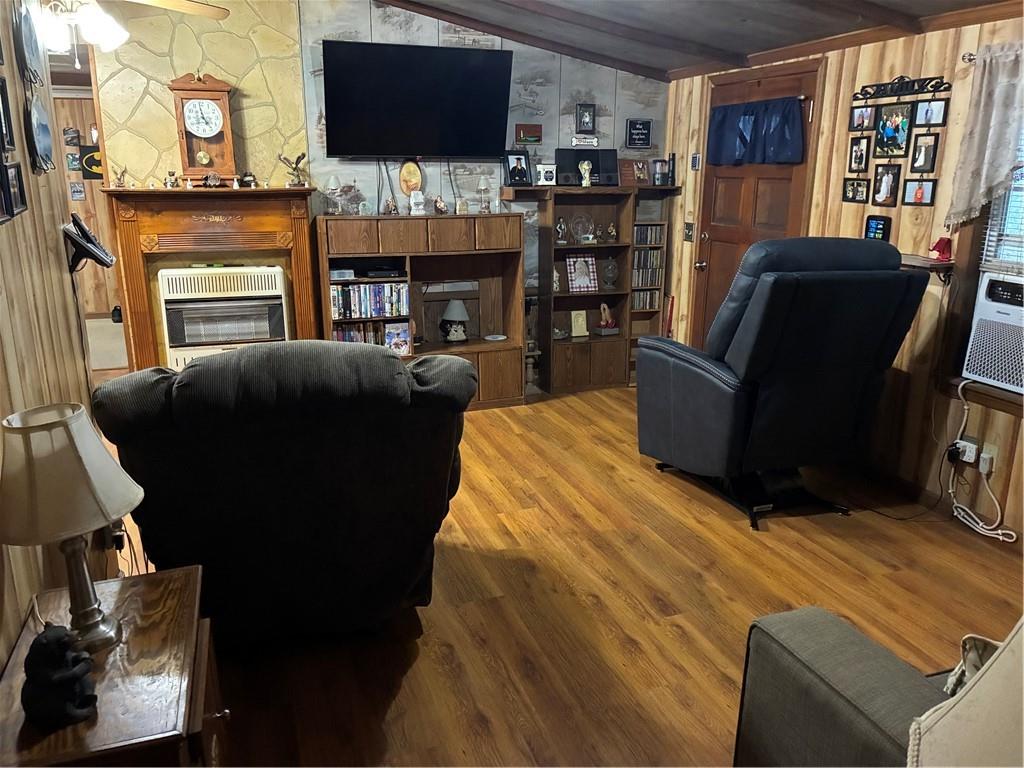 244 Manors Mill Road Dallas, GA 30157 - Photo 4 of 39 a living room with furniture and a flat screen tv