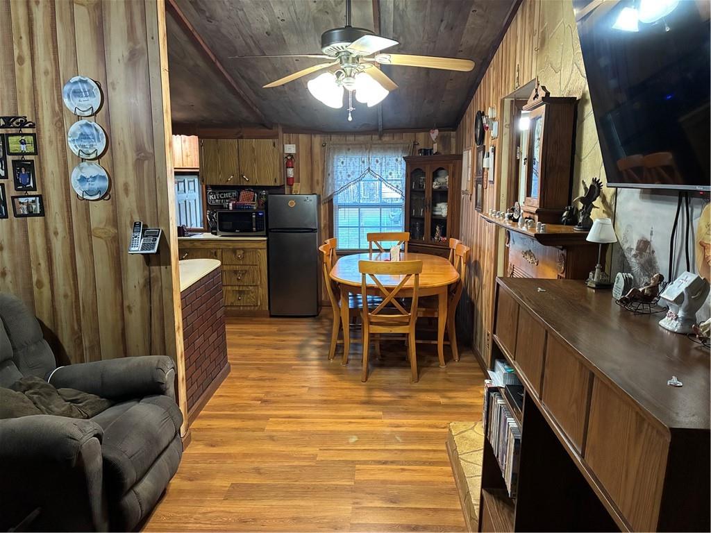 244 Manors Mill Road Dallas, GA 30157 - Photo 5 of 39 a living room with furniture a chandelier and a dining table