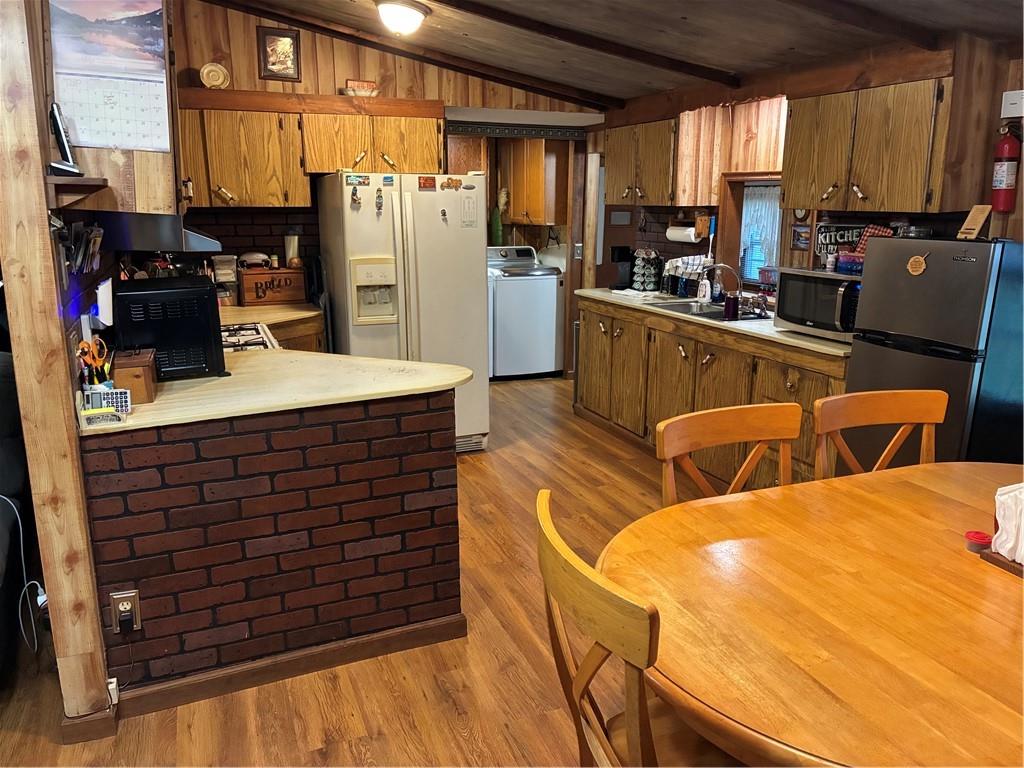 244 Manors Mill Road Dallas, GA 30157 - Photo 10 of 39 a view of a kitchen with refrigerator and chairs