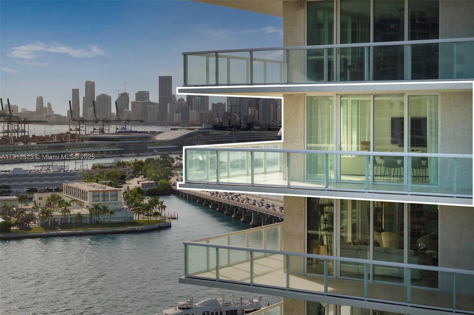450 Alton Road, Unit 2007 Miami Beach, FL 33139 - Photo 25 of 30 a balcony with a table and chairs