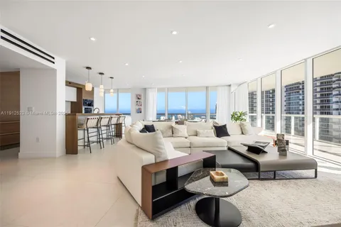 a living room with furniture and a table