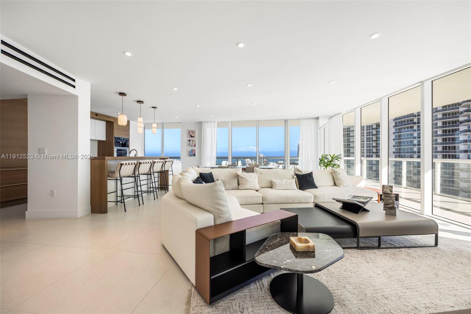 450 Alton Road, Unit 2007 Miami Beach, FL 33139 - Photo 9 of 30 a living room with furniture and a table