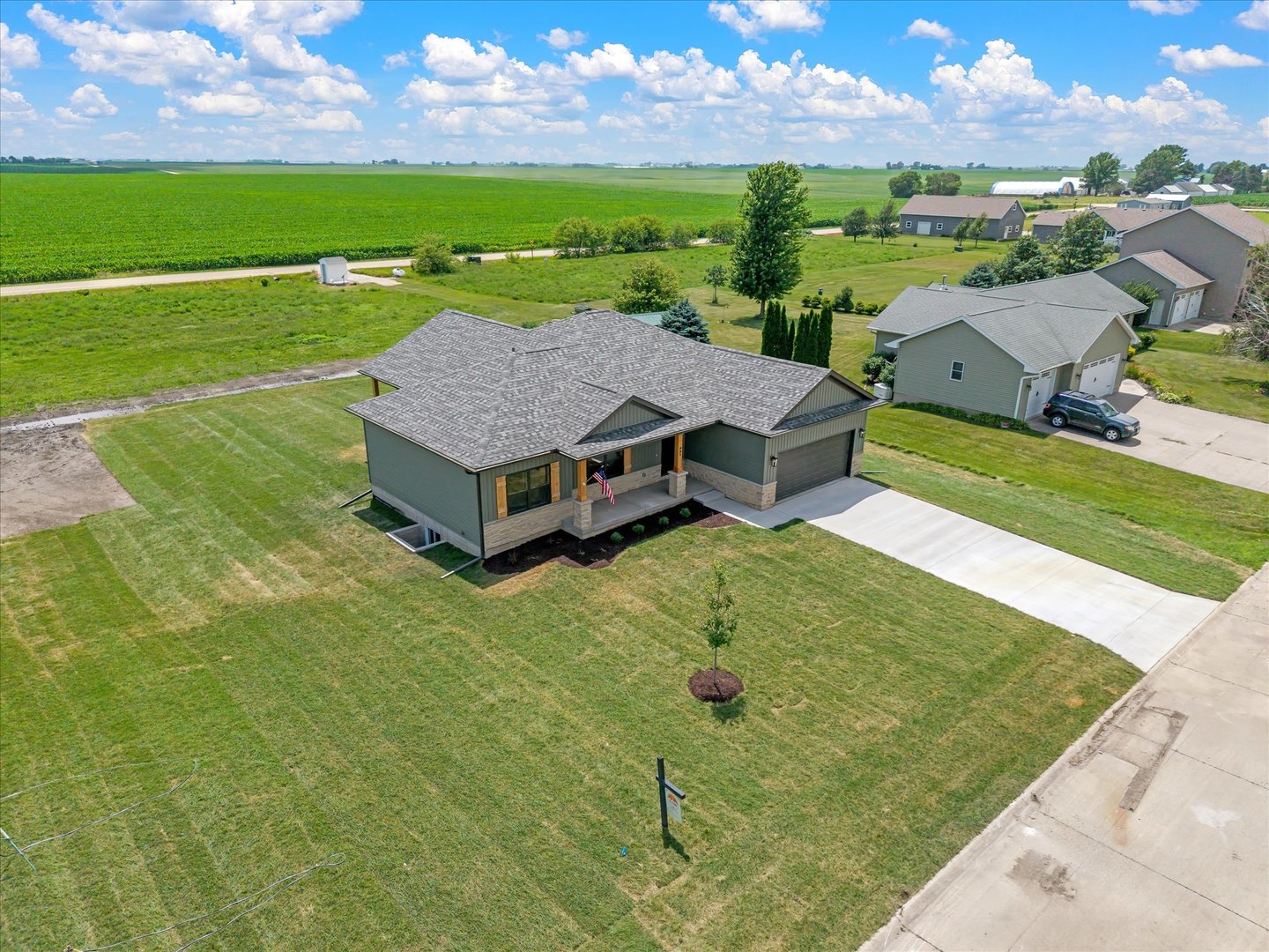 455 Rhonda Road New Liberty, IA 52765 - Photo 7 of 54 an aerial view of a house with green yard