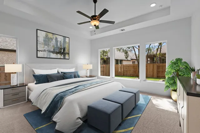 a bedroom with a large bed potted plant and a window