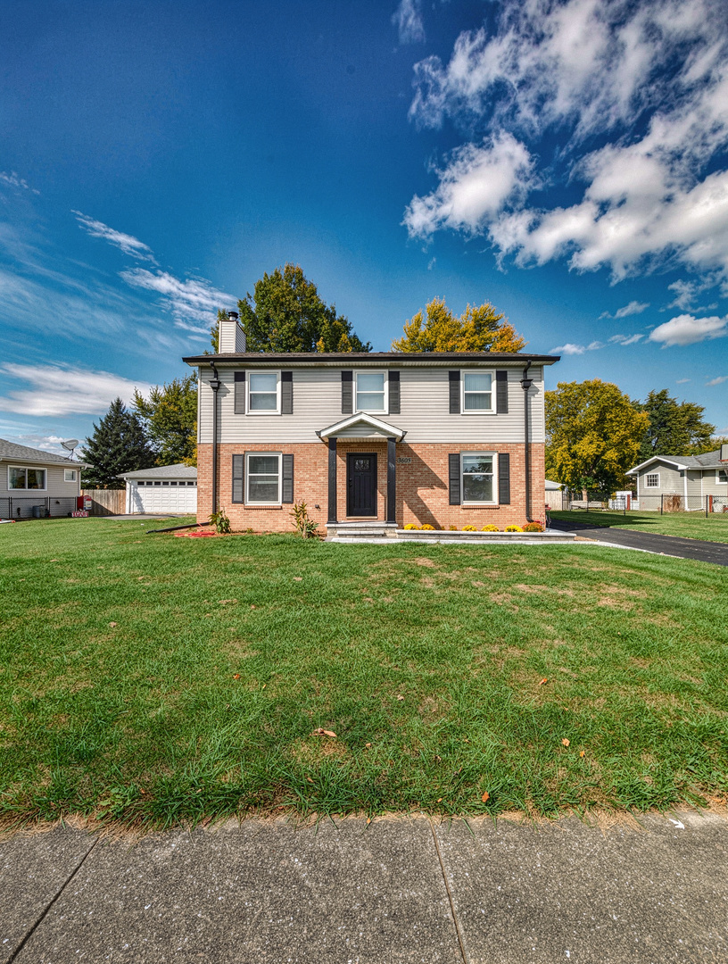 3605 Juniper Avenue Joliet, IL 60431 - Photo 1 of 18 a front view of a house with a yard