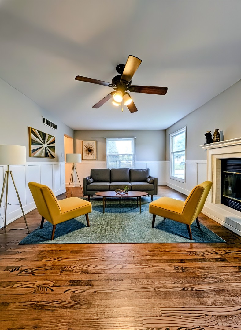 3605 Juniper Avenue Joliet, IL 60431 - Photo 11 of 18 a living room with furniture a rug and a fireplace