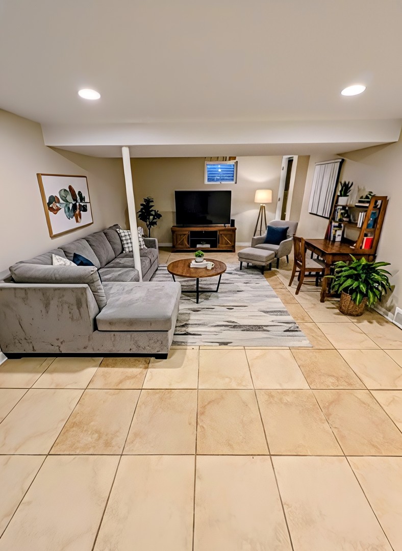 3605 Juniper Avenue Joliet, IL 60431 - Photo 18 of 18 a living room with furniture and a flat screen tv