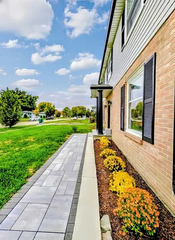 front view of a house with a yard