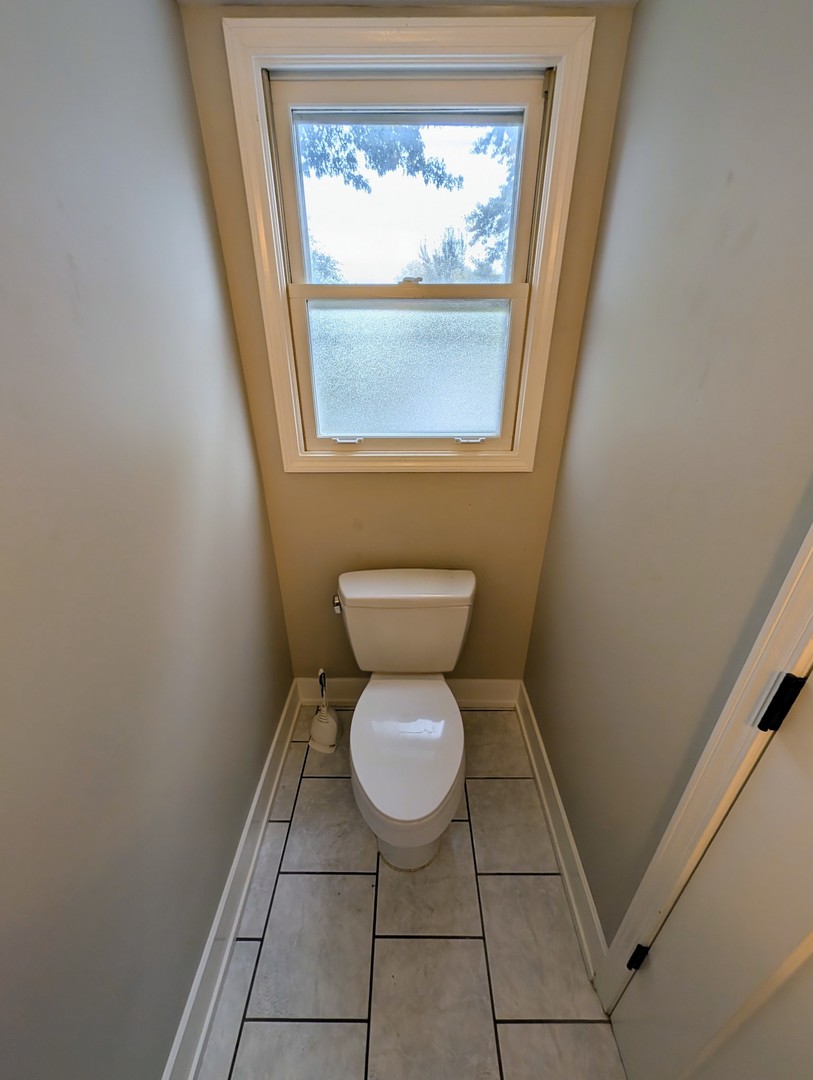 3605 Juniper Avenue Joliet, IL 60431 - Photo 9 of 18 a bathroom with a toilet