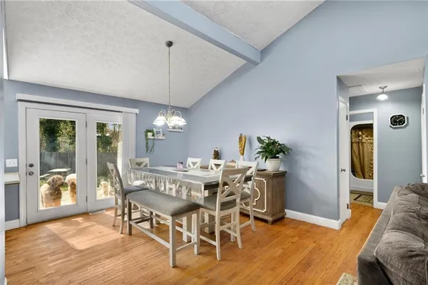 a dining room with furniture and window