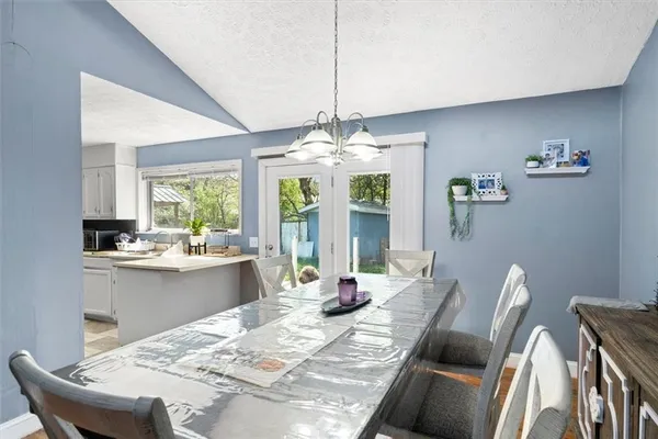 a kitchen with stainless steel appliances kitchen island granite countertop a refrigerator and a stove