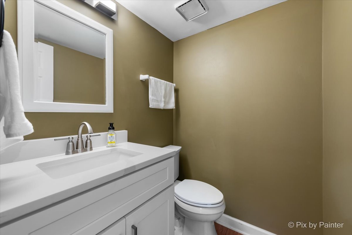 1025 Oswego Road Naperville, IL 60540 - Photo 16 of 42 a bathroom with a sink and a toilet