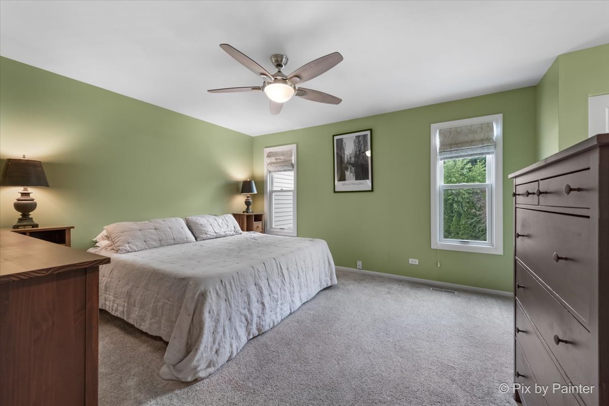 1025 Oswego Road Naperville, IL 60540 - Photo 18 of 42 a bedroom with a bed and a window