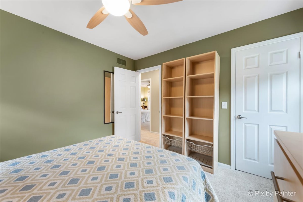 1025 Oswego Road Naperville, IL 60540 - Photo 22 of 42 a bedroom with a bed and a closet