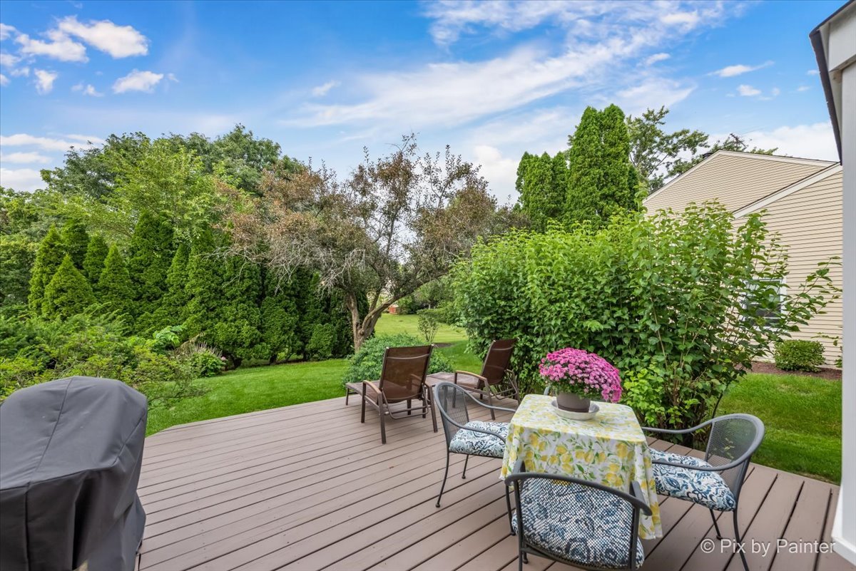 1025 Oswego Road Naperville, IL 60540 - Photo 25 of 42 a view of a table and chairs in patio of the house