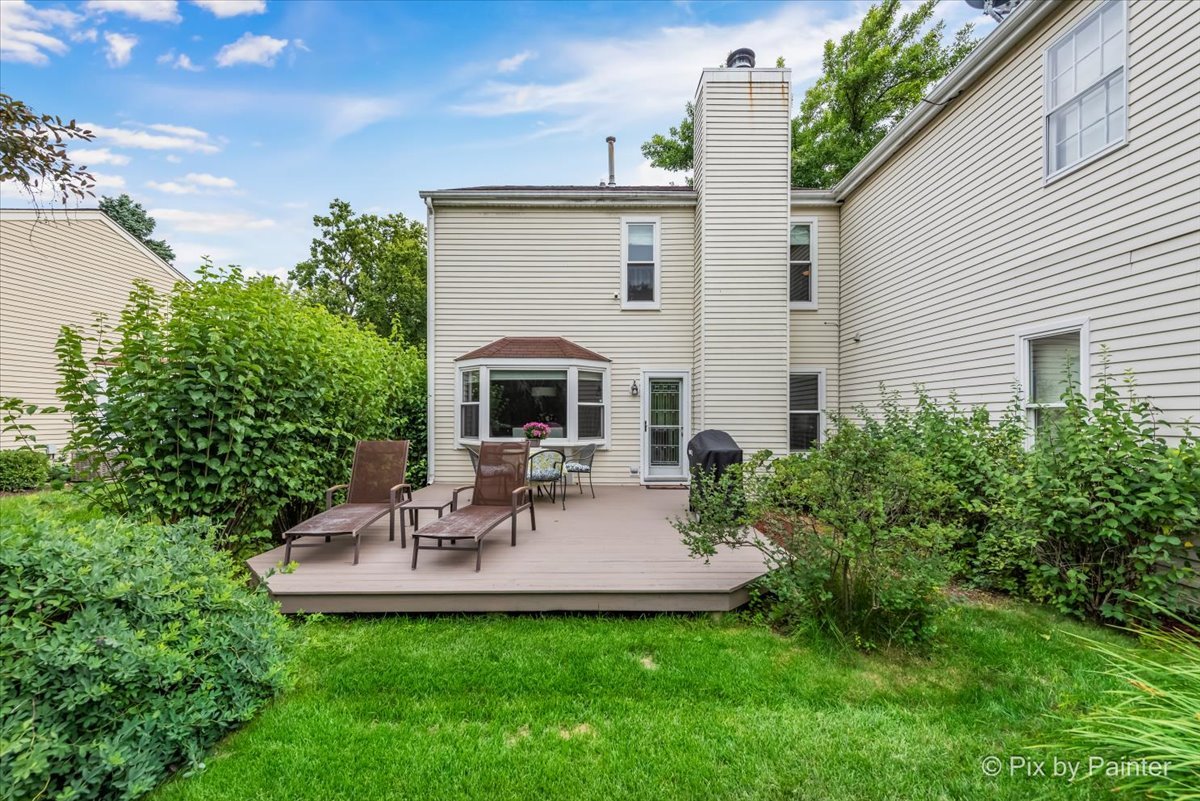 1025 Oswego Road Naperville, IL 60540 - Photo 26 of 42 a view of a patio with a table and chairs in patio