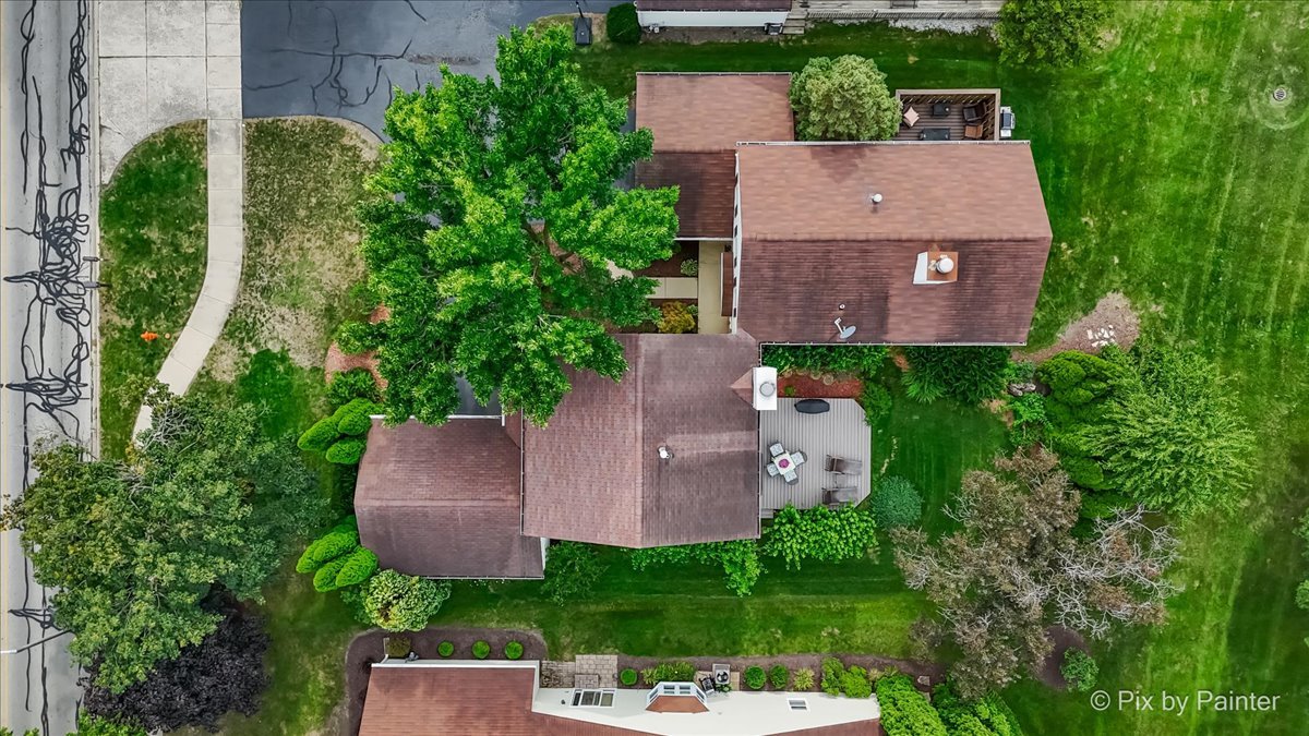 1025 Oswego Road Naperville, IL 60540 - Photo 32 of 42 an aerial view of a house with a garden and a yard