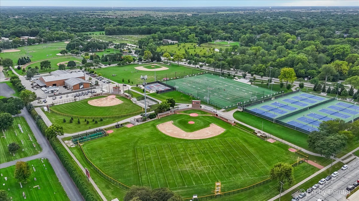 1025 Oswego Road Naperville, IL 60540 - Photo 39 of 42 an aerial view of a golf course with parking space