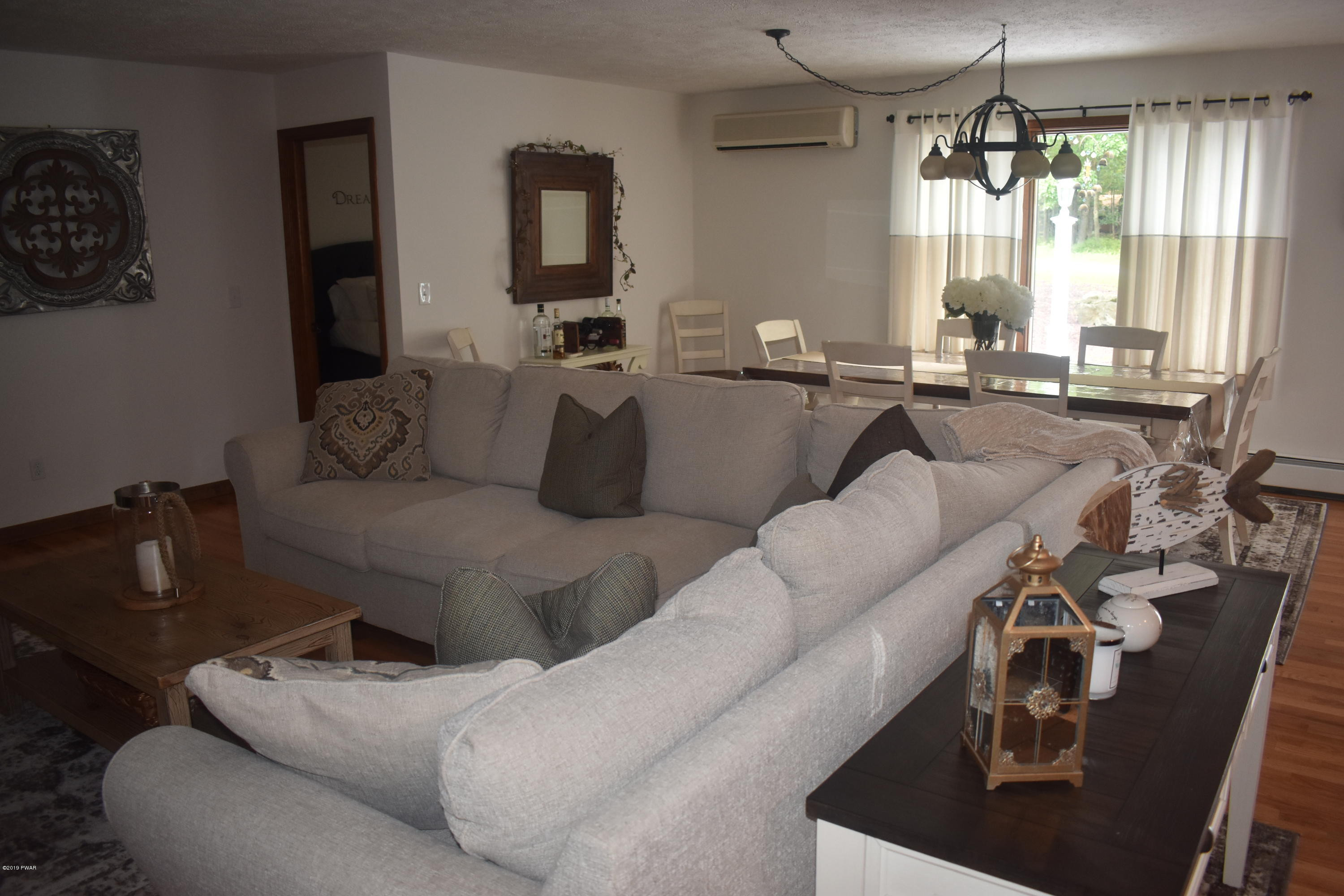 105 Rodeo Drive Hawley, PA 18428 - Photo 4 of 42 a living room with furniture and a large window