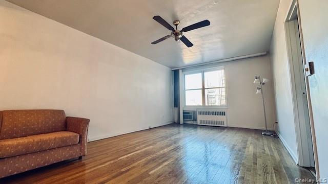 142-05 Roosevelt Avenue, Unit 521 Queens, NY 11354 - Photo 7 of 12 a living room with furniture and a window