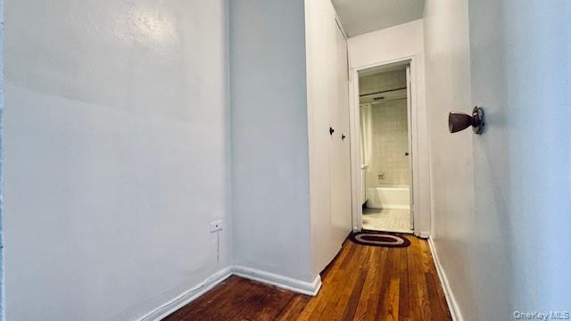 142-05 Roosevelt Avenue, Unit 521 Queens, NY 11354 - Photo 9 of 12 a view of a room with wooden floor and a shower