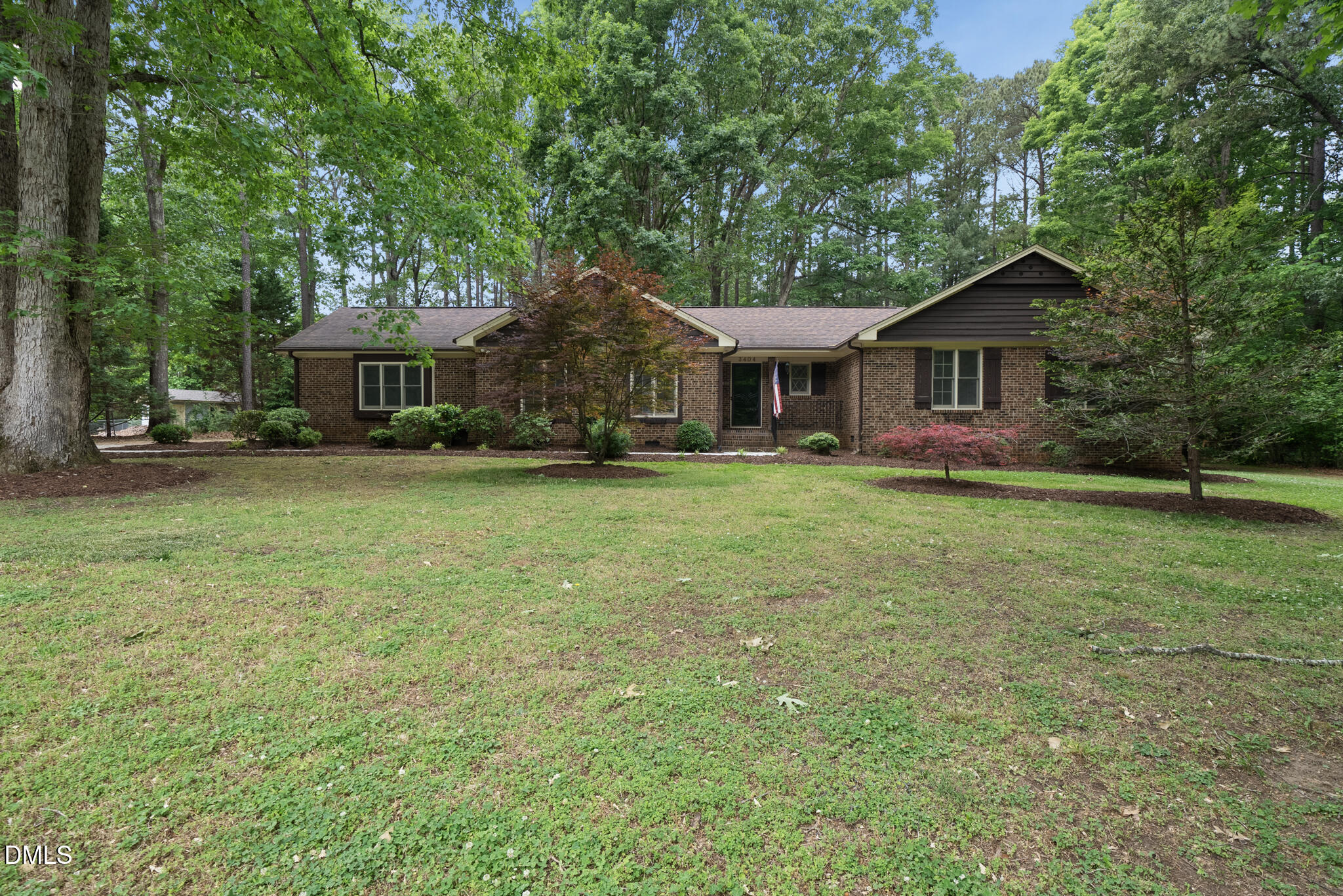 3404 Timberwood Court Raleigh, NC 27606 - Photo 39 of 45 front view of a house with a yard