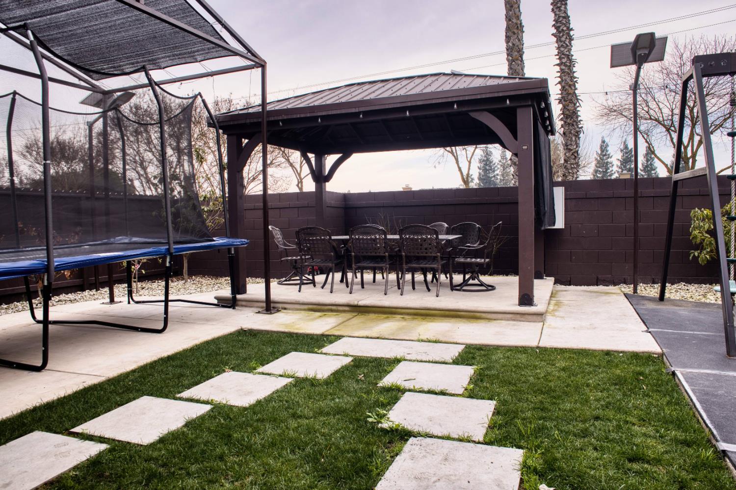 2520 Meadowrest Way Madera, CA 93637 - Photo 23 of 39 a view of a swimming pool with a patio