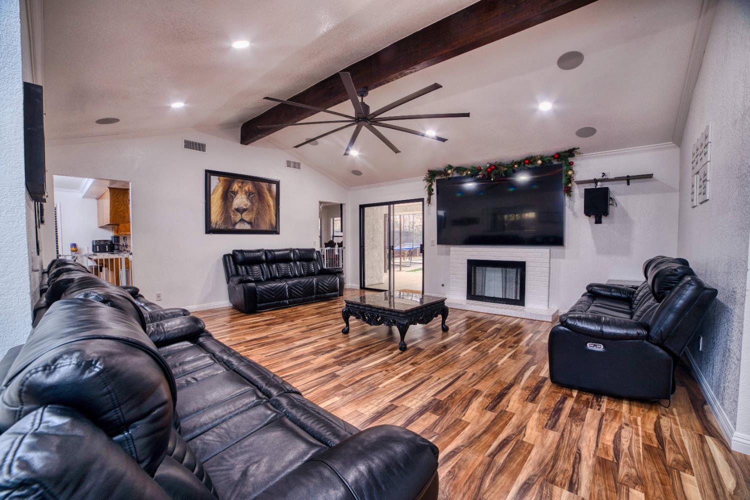 2520 Meadowrest Way Madera, CA 93637 - Photo 3 of 39 a living room with furniture a fireplace and a flat screen tv