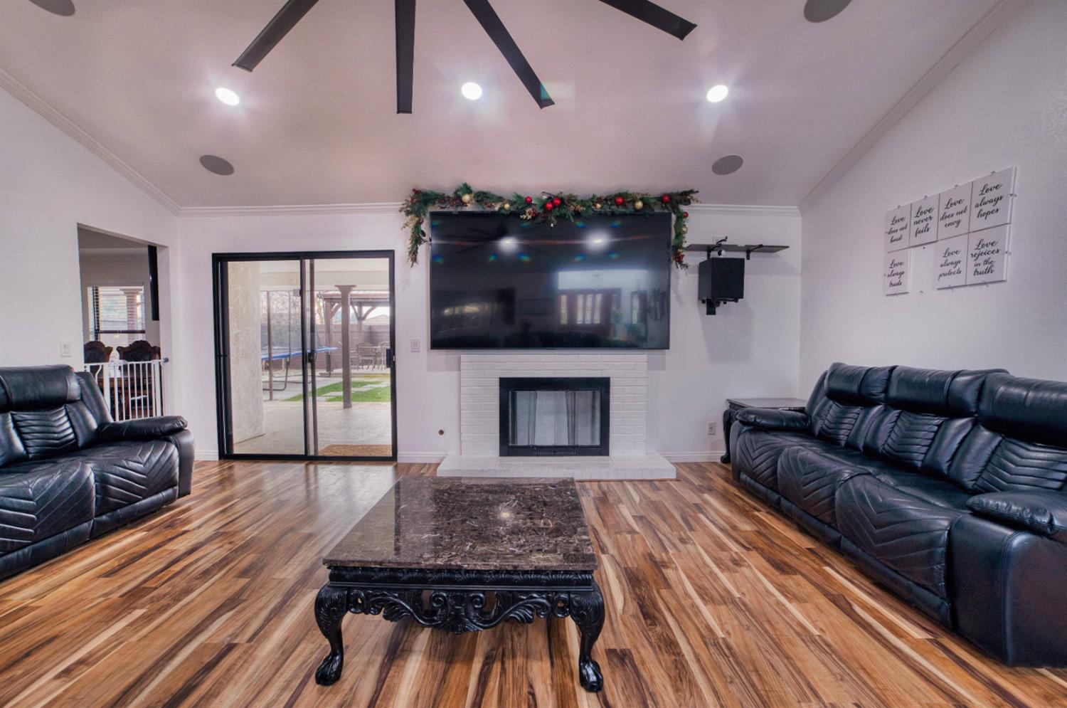 2520 Meadowrest Way Madera, CA 93637 - Photo 4 of 39 a living room with furniture and a flat screen tv
