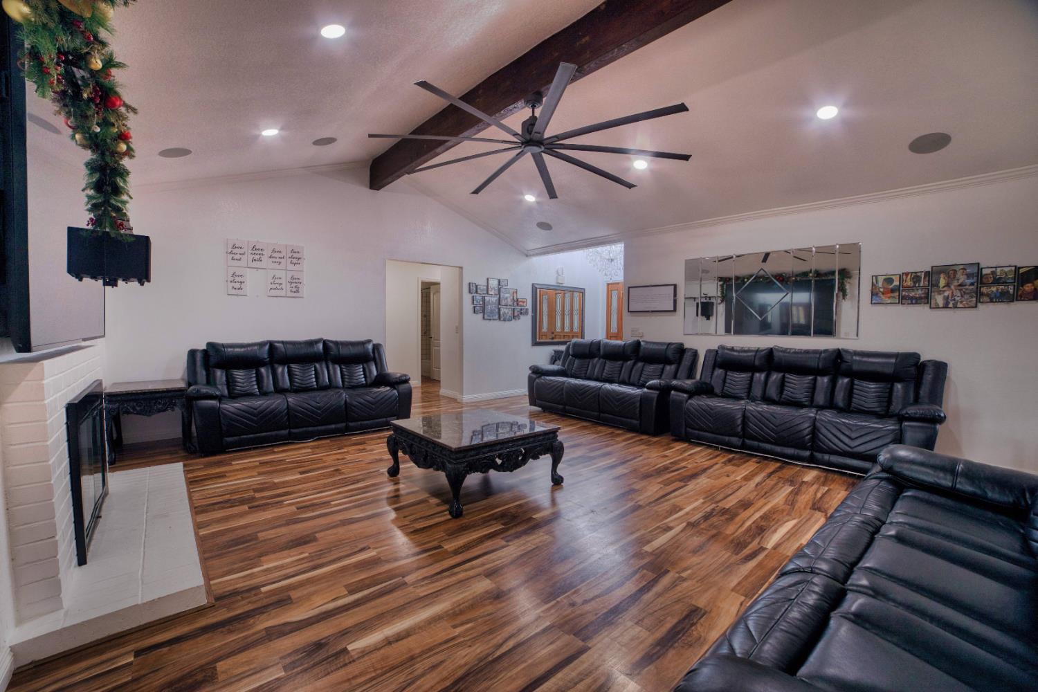 2520 Meadowrest Way Madera, CA 93637 - Photo 6 of 39 a living room with furniture ceiling fan and a rug