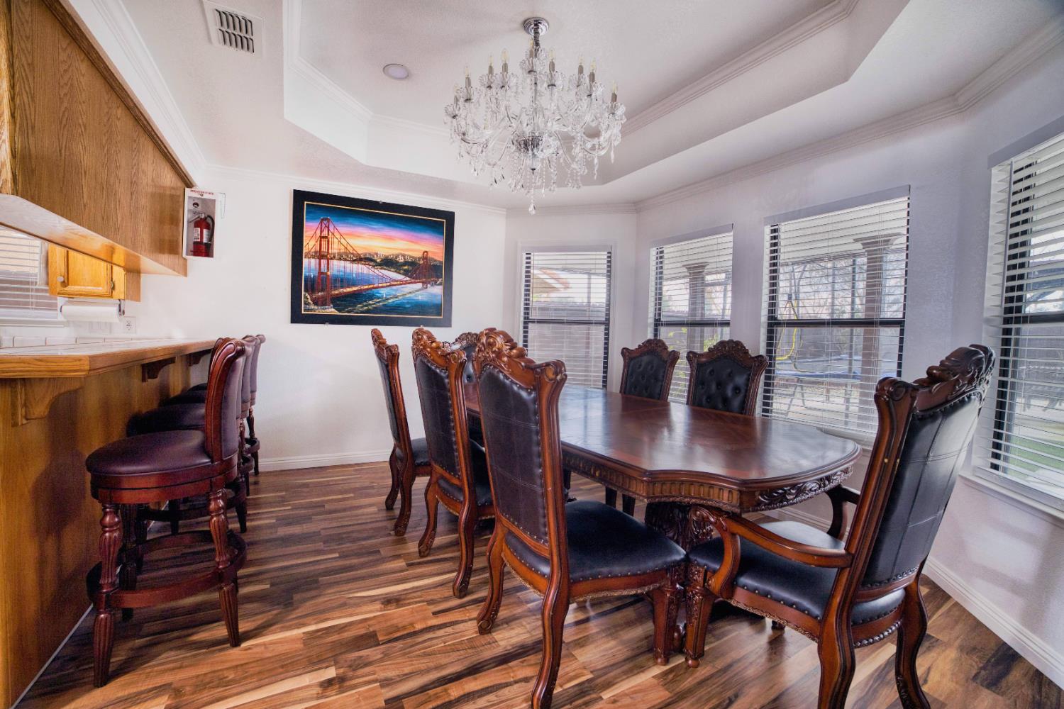 2520 Meadowrest Way Madera, CA 93637 - Photo 8 of 39 a view of a dining room with furniture window and wooden floor
