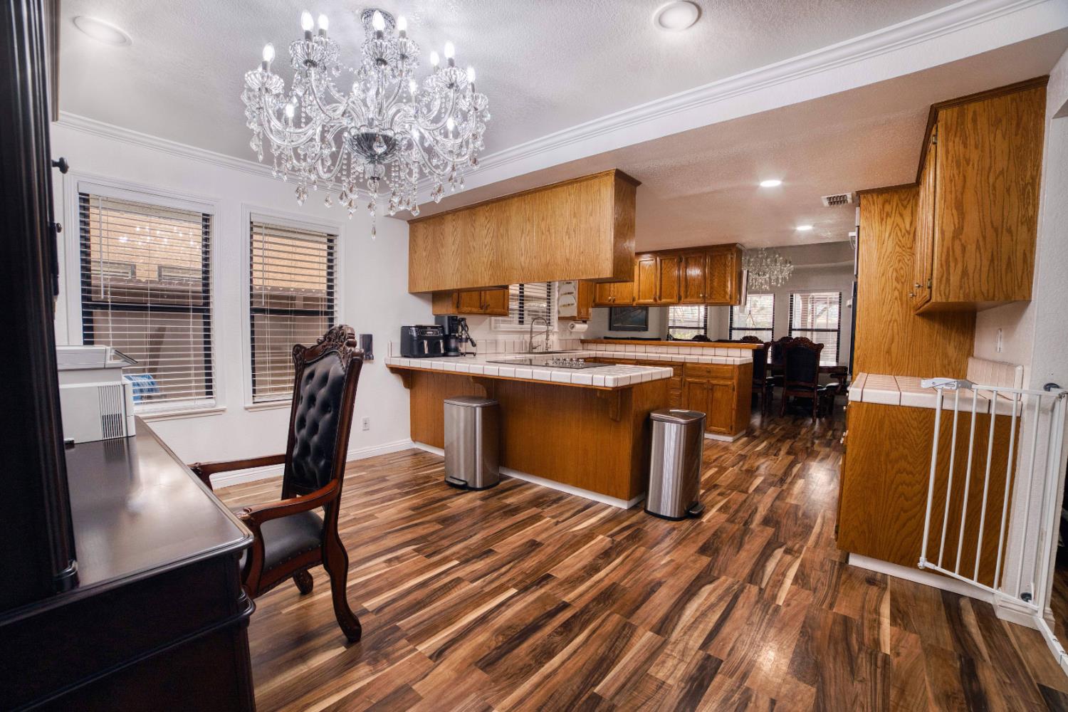 2520 Meadowrest Way Madera, CA 93637 - Photo 10 of 39 a view of a dining room with furniture window and wooden floor
