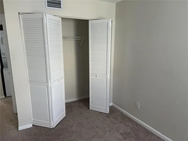 a view of a room that has a window