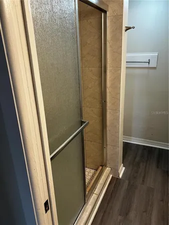 a view of a balcony with wooden floor