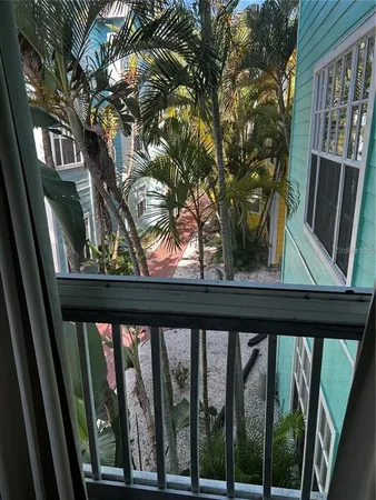 a view of a backyard with sitting area