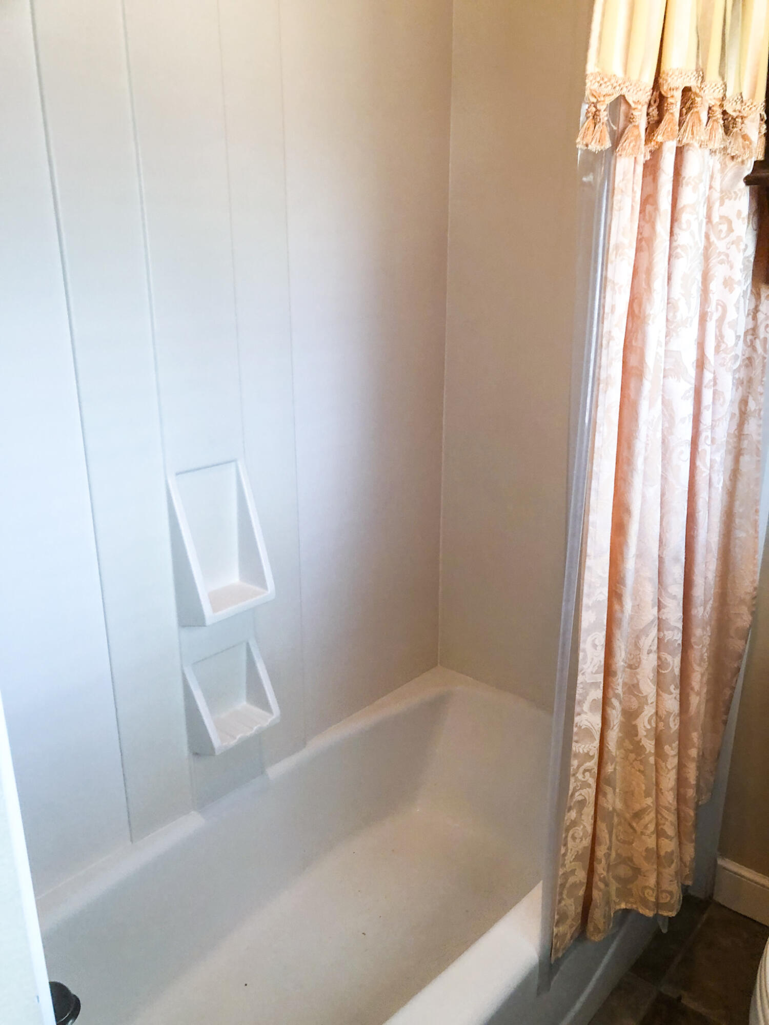 5502 156th Street Lubbock, TX 79424 - Photo 24 of 37 a bathroom with a bathtub