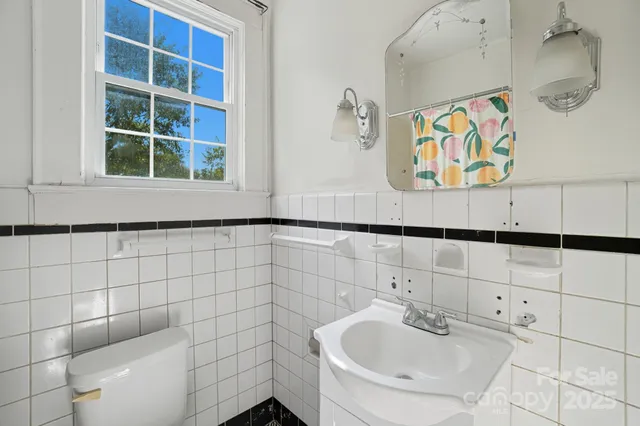 a bathroom with a sink and a window