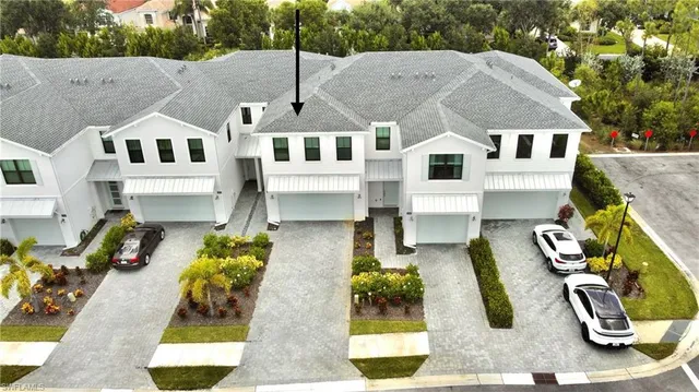 a aerial view of a house with swimming pool