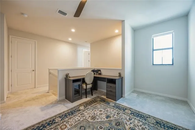 a view of a livingroom with furniture and window
