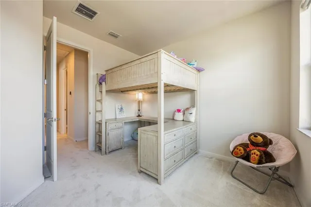 a storage room with a cabinet and mirrors