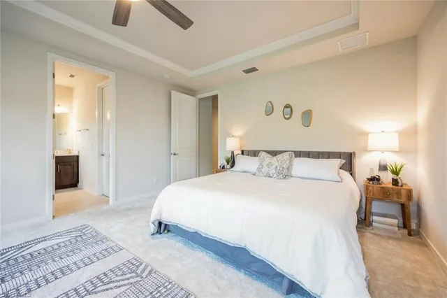 a bedroom with a bed and table