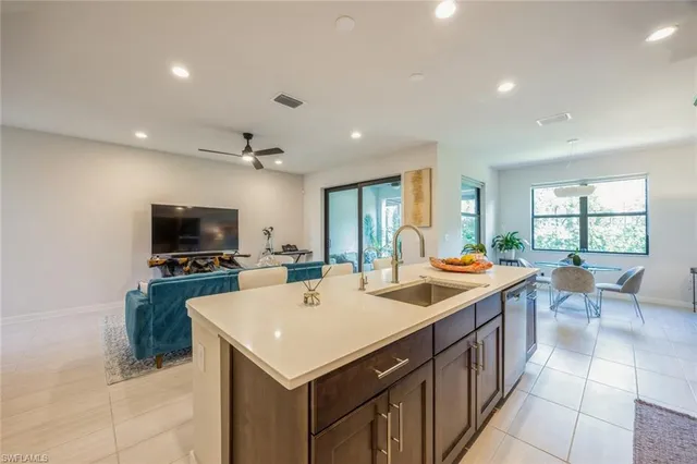a view of kitchen with sink and microwave