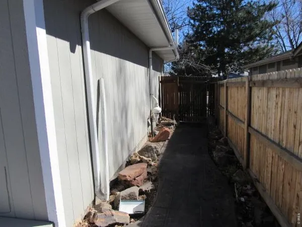 a view of a backyard of the house