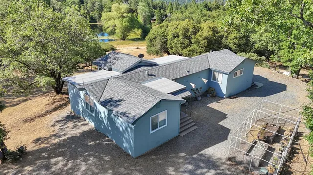 an aerial view of a house with outdoor space